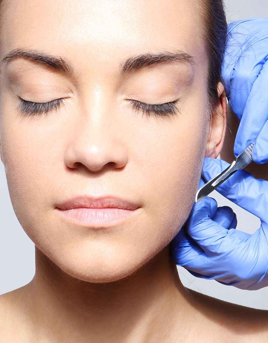 Correction,Of,Protruding,Ears.caucasian,Woman,During,Surgery,Using,A,Scalpel