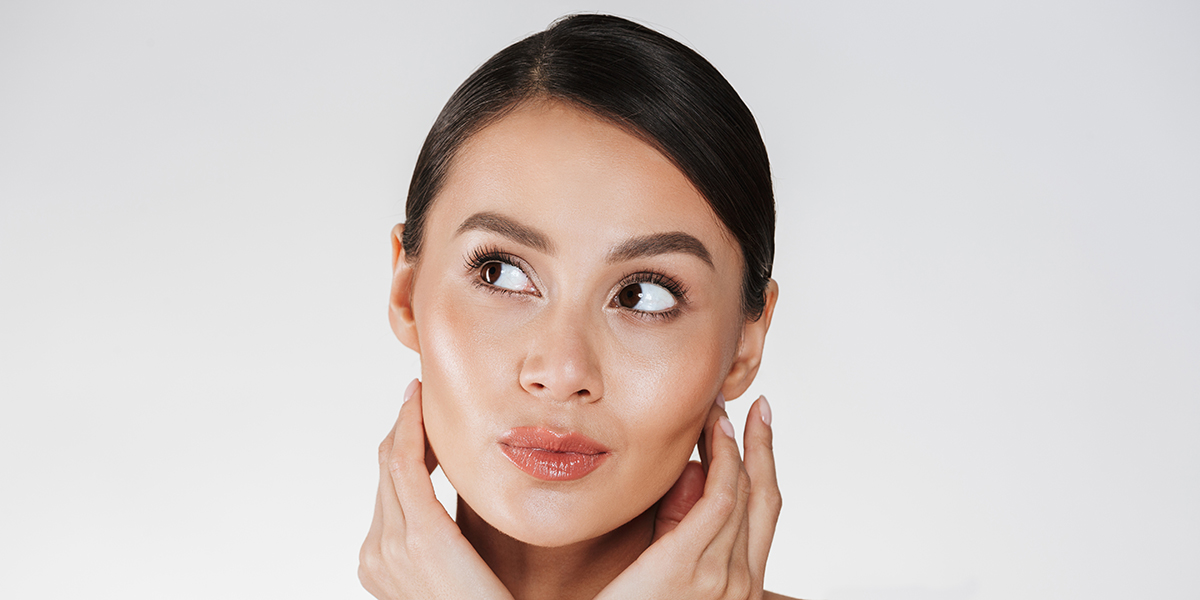 Close up portrait of beautiful woman with natural makeup looking